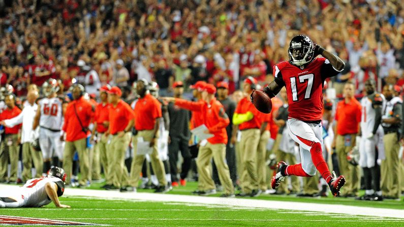Atlanta Falcons punt returner Devin Hester high-steps into the end zone — Deion Sanders-style — to score a touchdown against Tampa Bay on Thursday, September 18, in Atlanta. The touchdown gave Hester 20 career touchdown returns, surpassing the NFL record he once shared with Sanders.
