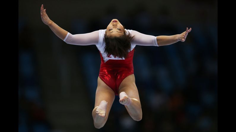 Japanese gymnast Akiho Sato leaps on the balance beam during qualifying Monday, September 22, at the Asian Games in Incheon, South Korea.