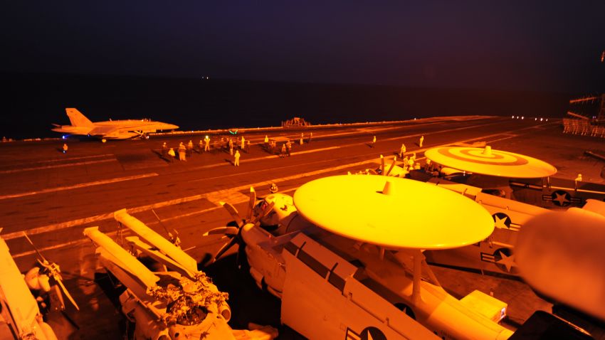 140923-N-MT637-071 
ARABIAN GULF (Sept. 23, 2014) An F/A-18C Hornet, attached to Strike Fighter Squadron (VFA) 87, prepares to launch from the flight deck of the aircraft carrier USS George H.W. Bush (CVN 77) to conduct strike missions against ISIL targets. George H.W. Bush is supporting maritime security operations and theater security cooperation efforts in the U.S. 5th Fleet area of responsibility. (U.S. Navy photo by Mass Communication Specialist 3rd Class Robert Burck/Released)
