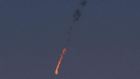 A Syrian fighter jet is in flames Tuesday after being hit by the Israeli military over the Golan Heights.