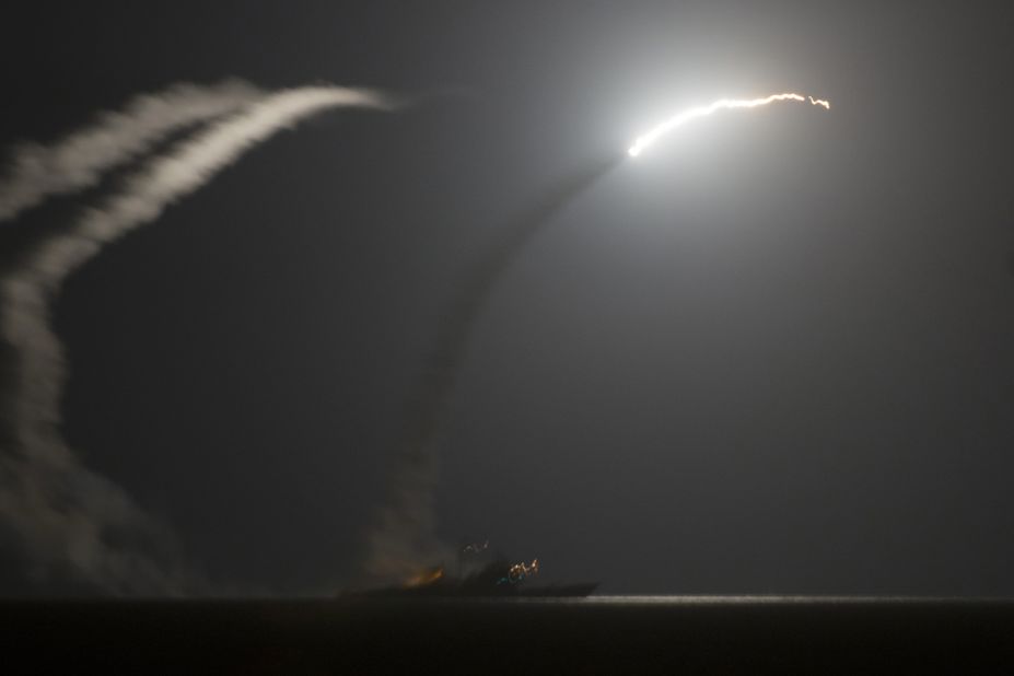 Tomahawk missiles fired by the USS Philippine Sea fly in the air above the Persian Gulf on September 23.