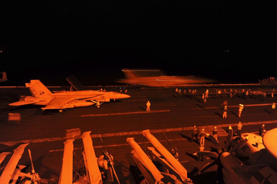 Two more U.S. fighter jets prepare to take off from the USS George H.W. Bush and conduct airstrikes against ISIS targets in Syria.