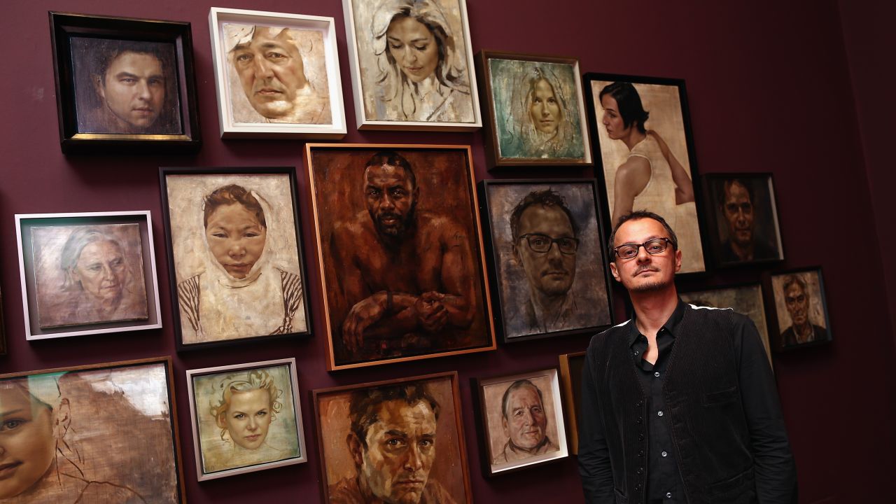 Caption:LONDON, ENGLAND - SEPTEMBER 10: Artist Jonathan Yeo poses in front of a selection of his celebrity portraits at the National Portrait Gallery on September 10, 2013 in London, England. The exhibition of celebrity portraits includes the first painted portrait of education activist Malala Yousafzai and will run from September 10, 2013 - January 5, 2014. (Photo by Dan Kitwood/Getty Images)