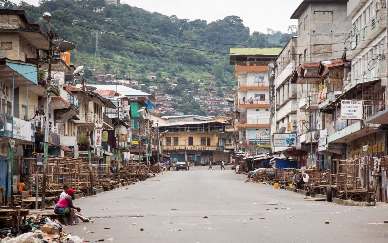 A few people are seen in Freetown during a three-day nationwide lockdown on September 21, 2014. In an attempt to curb the spread of the Ebola virus, people in Sierra Leone were told to stay in their homes.