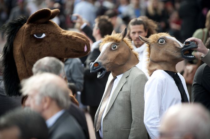 Not all racegoers take the chic side of their attendance too seriously, as shown by this trio of horse heads.