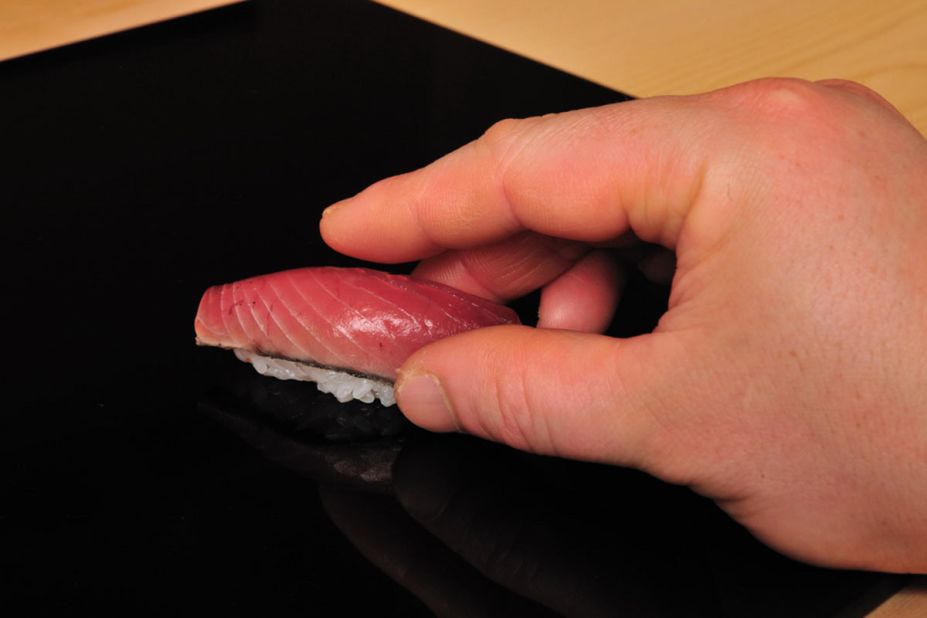 1. Grip the sushi -- don't squeeze.
