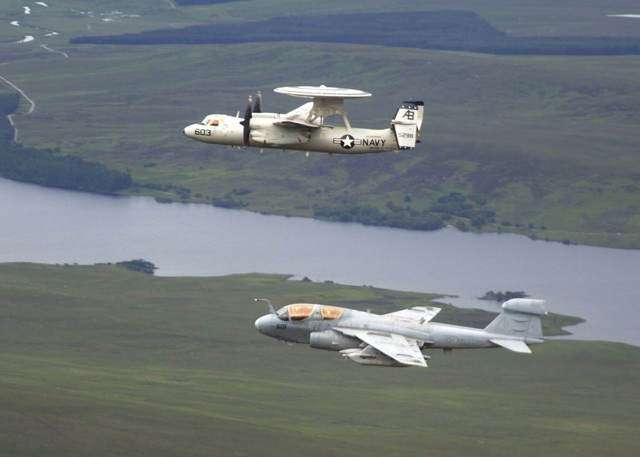 EA-6B Prowlers are among the U.S. aircraft that took off from the USS George H.W. Bush during attacks on ISIS. The Prowler is used to support attack aircraft by jamming enemy radar and communications and obtaining tactical intelligence. Here, a Prowler -- seen at bottom -- flies in formation with an E-2C Hawkeye in June 2004.