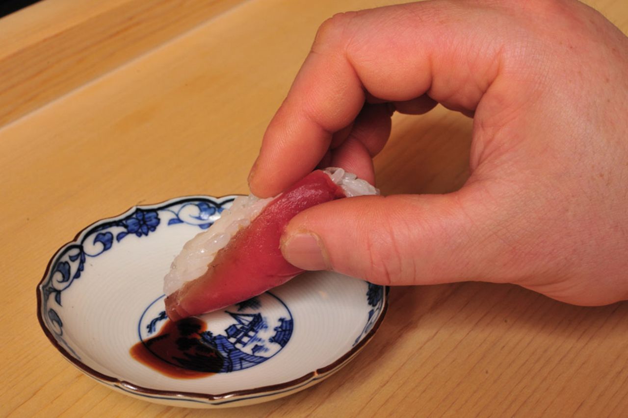 4. Dip lightly into soy sauce.
