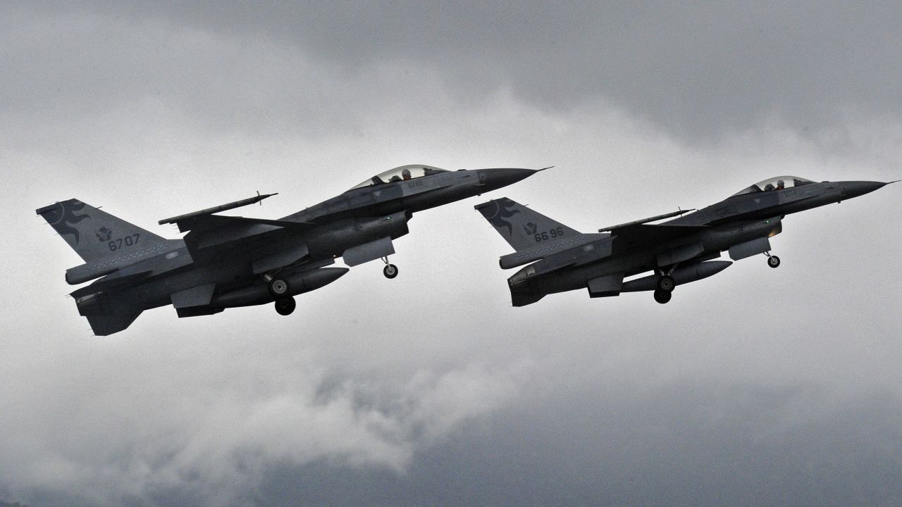 Two US-made F-16 fighters in the air during an scramble take off at the eastern Hualien air force base on January 23, 2013. 