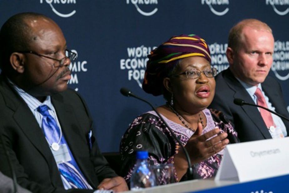 Nigeria's Finance Minister Ngozi Okonjo-Iweala discusses MasterCard collaboration with senior officials at the World Economic Forum