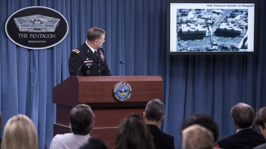 Lt. Gen. William C. Mayville Jr., Joint Staff Director of Operations Director of Operations, shows before and after images of airstrikes in Syria during a briefing at the Pentagon September 23, 2014 in Washington, DC. Mayville briefed the press about US and Arab nation joint airstrikes against Islamic State group targets in Syria and unilateral airstrikes against an al-Qaeda group in Syria. AFP PHOTO/Brendan SMIALOWSKI (Photo credit should read BRENDAN SMIALOWSKI/AFP/Getty Images)