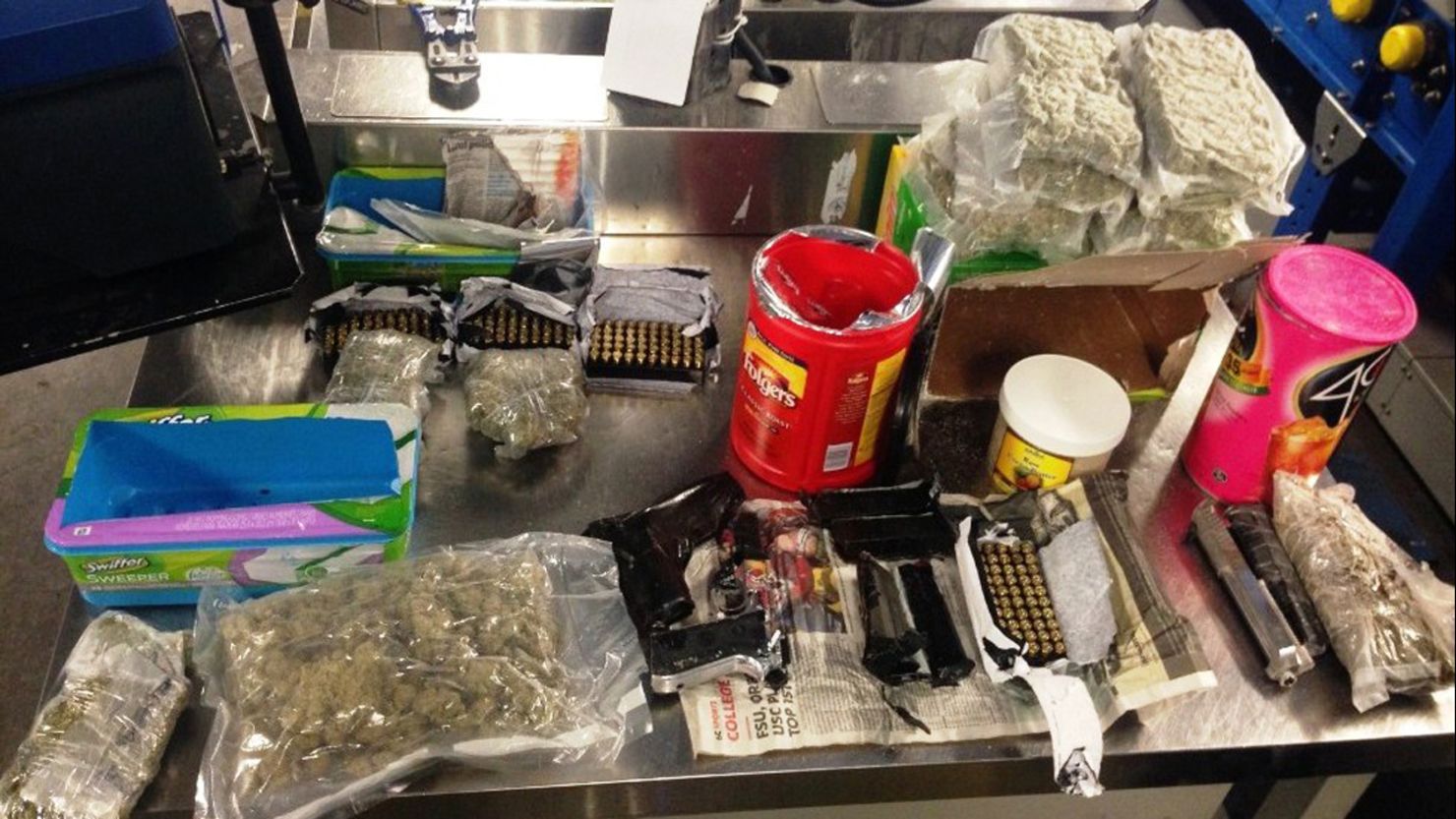 The TSA says a woman at John F. Kennedy International tried to smuggle weapons and marijuana in her luggage.
