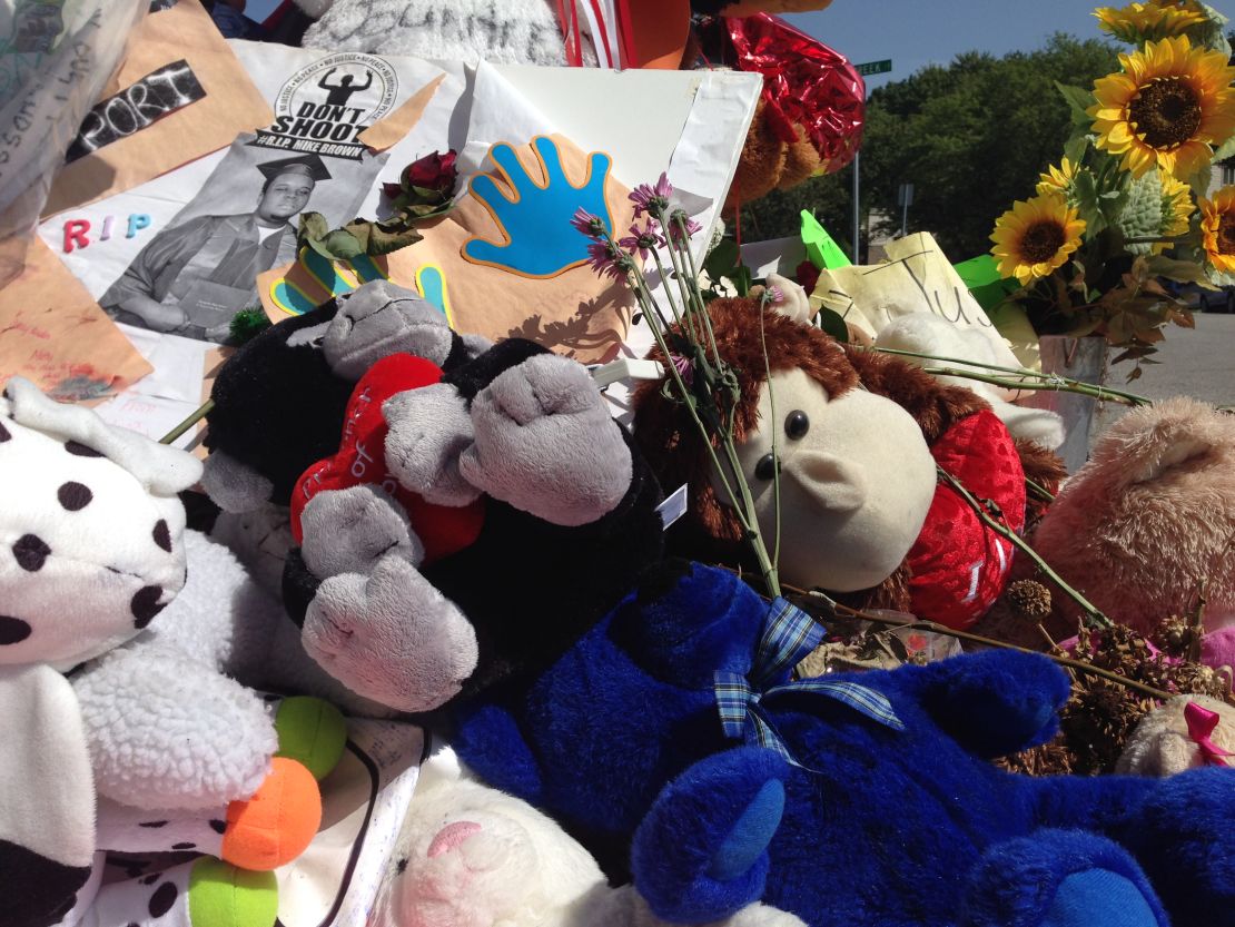 Before it burned Tuesday, the Michael Brown memorial consisted largely of stuffed animals and flowers. 