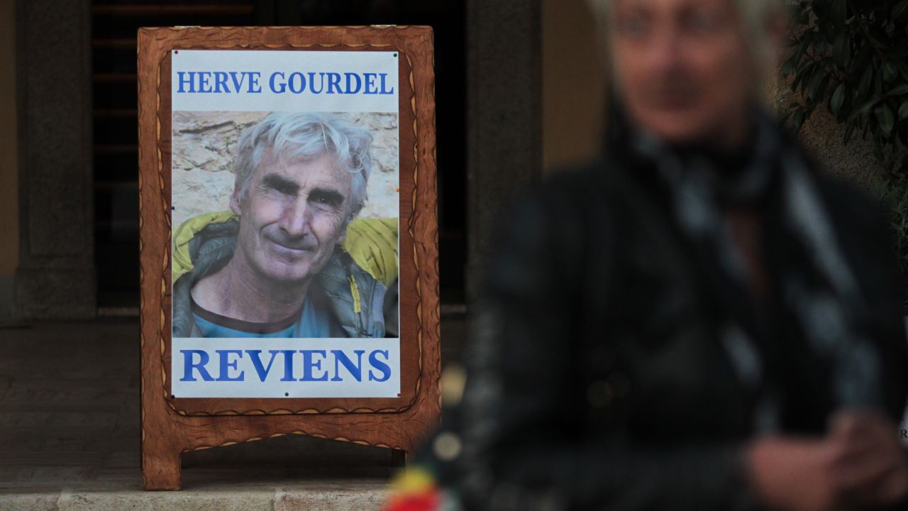 This picture taken on September 23, 2014 shows a poster depicting Herve Gourdel, in Saint-Martin-Vesubie, southeastern France.