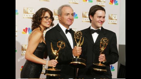 Tina Fey, Lorne Michaels, center, and Dennis McNicholas with Emmys in 2002.