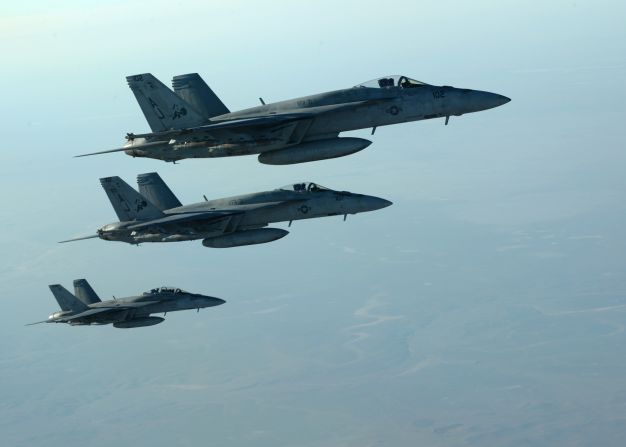 In this photo released by the U.S. Air Force, fighter jets fly over northern Iraq as part of coalition airstrikes in Syria on Tuesday, September 23. The United States and several Arab nations <a href="index.php?page=&url=http%3A%2F%2Fwww.cnn.com%2F2014%2F09%2F23%2Fworld%2Fmeast%2Fisis-airstrikes%2Findex.html">have started bombing ISIS targets</a> in Syria to take out the militant group's ability to command, train and resupply its fighters.