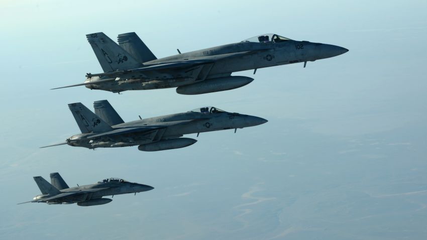 In this Tuesday, Sept. 23, 2014 photo released by the U.S. Air Force, a formation of U.S. Navy F-18E Super Hornets leaves after receiving fuel from a KC-135 Stratotanker over northern Iraq, as part of U.S. led coalition airstrikes on the Islamic State group and other targets in Syria.