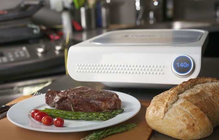 <strong><em>Take the guesswork out of cooking</em></strong><br /><br />The George Foreman grill might finally see a new contestant enter the ring: it's called the Palate Smart Grill and it promises restaurant-level cooking finesse at home, at the press of a button. Or rather, a tap on a screen.<br /><br />You just tell the machine what you're cooking and how you want it cooked, all through a smartphone and tablet app, and the Palate does everything else for you, using its many sensors and its ability to monitor the temperature down to 0.2 degrees Celsius of precision. <br /><br />Overcooked? Undercooked? Never again. That hint of disappointment on your guests' faces at dinner parties? Forget about it. The grill isn't yet available to buy, but eager customers can choose to be <a href="http://www.palatehome.com/" target="_blank" target="_blank">notified</a> as soon as it will be.