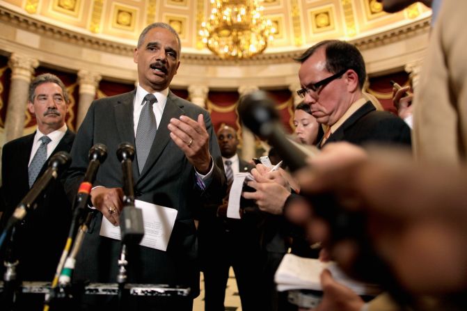 Holder talks to reporters after meeting with U.S. Rep. Darrell Issa, chairman of the House Oversight and Government Reform Committee, in June 2012. Issa and Holder met to discuss releasing documents related to the botched <a href="index.php?page=&url=http%3A%2F%2Fwww.cnn.com%2F2013%2F08%2F27%2Fworld%2Famericas%2Foperation-fast-and-furious-fast-facts%2F">Fast and Furious</a> investigation.