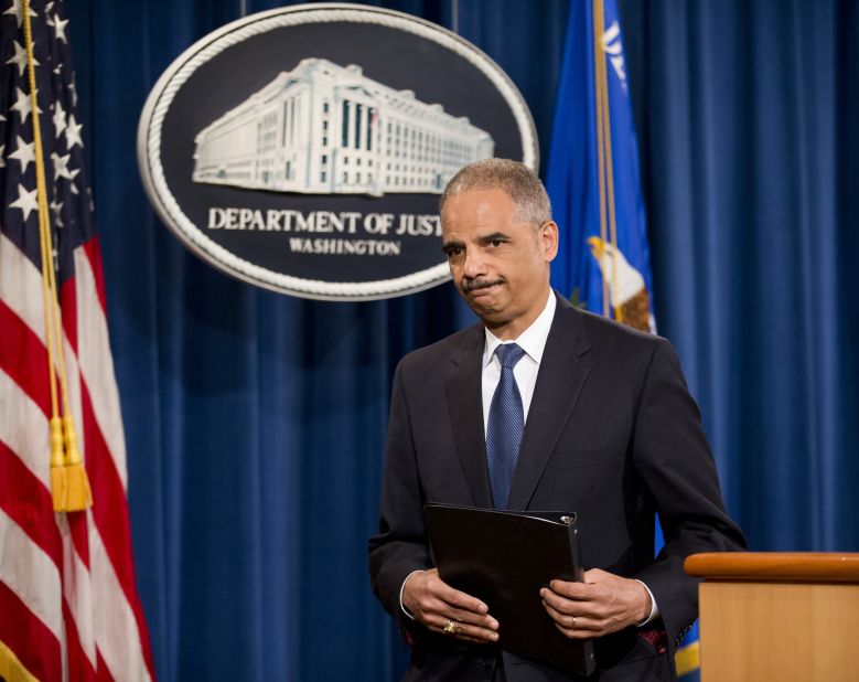 Holder leaves after speaking of his disappointment in a Supreme Court ruling that declared a key part of the Voting Rights Act unconstitutional in June 2013.