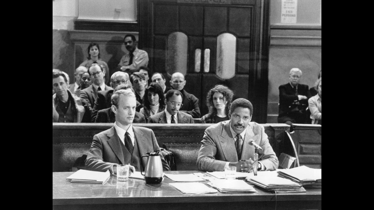 <strong>"Philadelphia" (1993)</strong>: The wonder of a Washington performance is that he can play an abrasive character and not make you hate him (at least, not completely). In "Philadelphia," the story of a lawyer (Tom Hanks, foreground left) who sues when his firm discriminates against him for his HIV status, Washington plays the attorney who represents him and who is as bigoted (initially, at least) as the lawsuit's defendants.