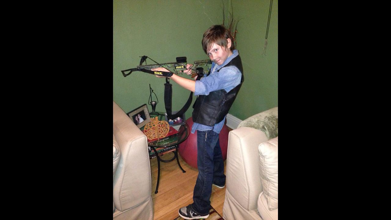 <a href="http://ireport.cnn.com/docs/DOC-1165141">Garrett Phillips</a>' 10-year-old daughter, Evie, dressed up as Daryl Dixon, her favorite character from "The Walking Dead," last Halloween. "She's all girl with ears pierced and painted fingernails but wants to wear boys' clothes and play sports with boys," her father said.