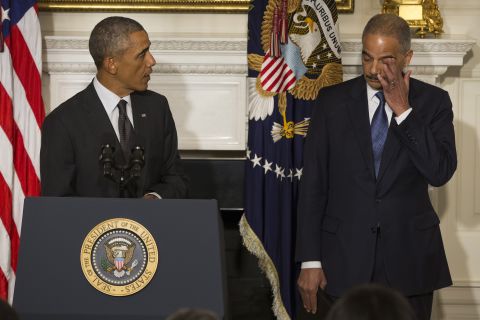 Holder wipes away tears in September 2014 as <a href="http://www.cnn.com/2014/09/25/politics/eric-holder-resignation/index.html">his resignation is announced</a> by President Barack Obama in Washington. Holder, who led the Department of Justice for six years, stayed in the position until his replacement, Loretta Lynch, was confirmed.