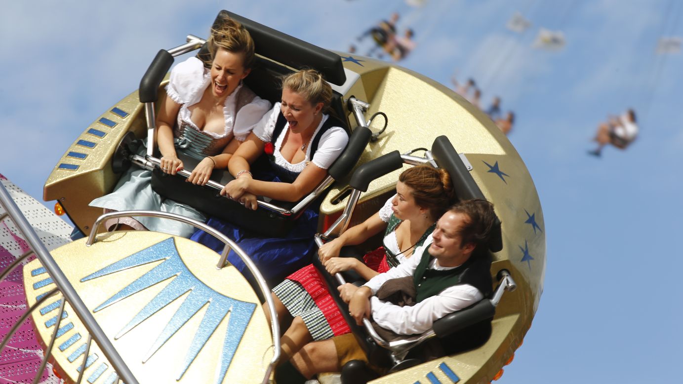 Festivalgoers enjoy an amusement ride Saturday, September 20, on the opening day of Oktoberfest in Munich, Germany. Millions of beer drinkers from around the world will be attending the event, which runs through October 5.