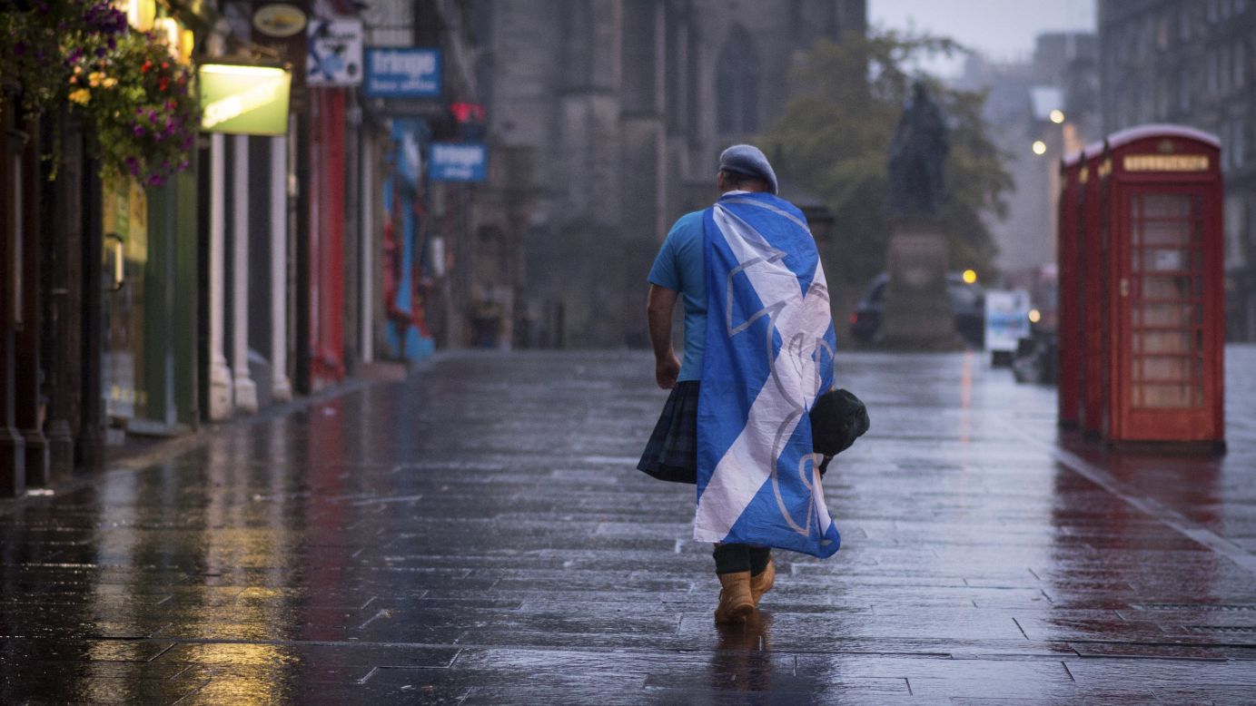 A supporter of Scottish independence walks down a street in Edinburgh, Scotland, on Friday, September 19, after it was confirmed that a majority of <a href="http://www.cnn.com/2014/09/18/europe/gallery/scotland-independence-vote/index.html">Scottish voters</a> -- 55% to 45% -- rejected a proposal to break away from the United Kingdom.