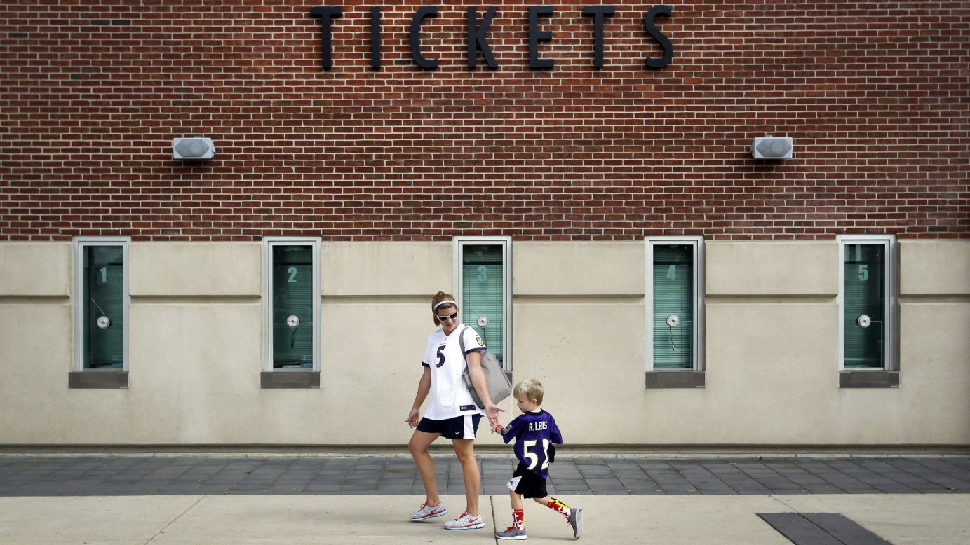 Kristen Moyer gives her son a five after they traded in his jersey of Baltimore Ravens running back Ray Rice on Friday, September 19. The Ravens allowed fans to trade in their Rice jerseys and get another player's jersey for free after Rice was cut by the team and suspended by the NFL for domestic violence.
