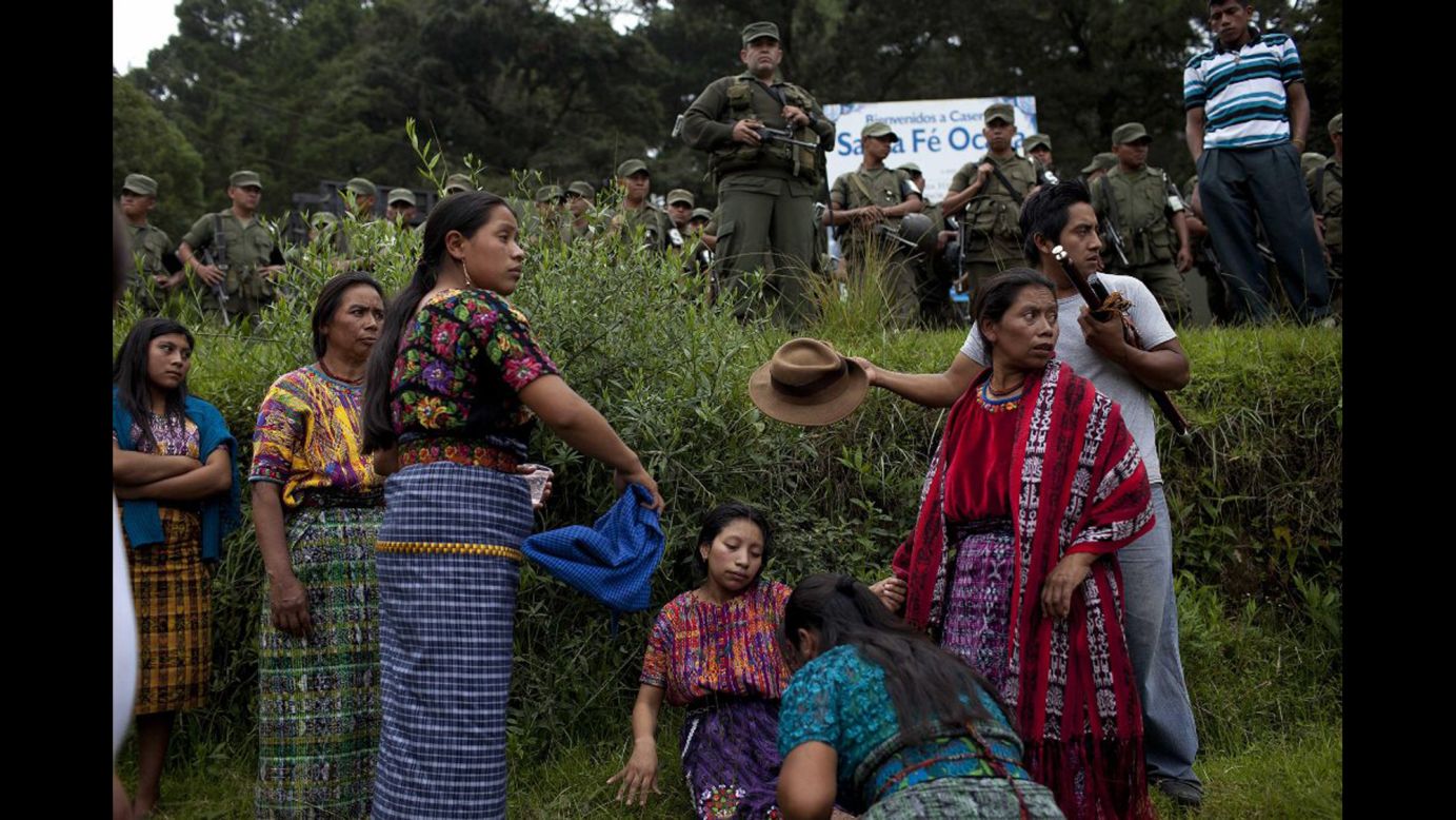 On Monday, September 22, people bury relatives who recently died in clashes over a cement factory in the Guatemalan municipality of San Juan Sacatepequez. The Guatemalan government has ordered a state of emergency for the municipality, where at least eight people have died in clashes between those who support the factory's operation and those who reject it.