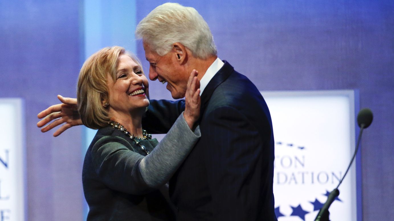 Former U.S. President Bill Clinton and his wife, former U.S. Secretary of State Hillary Clinton, embrace Monday, September 22, during a session at the Clinton Global Initiative in New York. The Clinton Global Initiative <a href="http://www.cnn.com/2014/09/25/politics/bill-clinton-cgi/index.html">was founded in 2005</a> to bring together world leaders to discuss and implement solutions to the world's problems, Bill Clinton said at the time.