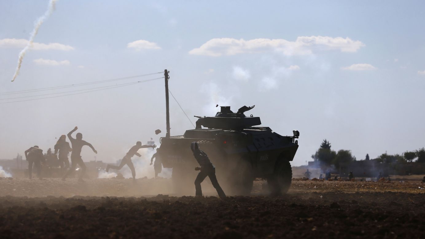 Turkish Kurds clash with Turkish security forces during a protest near Suruc, Turkey, on Monday, September 22. According to <a href="http://time.com/3423522/turkey-syria-isis-isil-refugees/" target="_blank" target="_blank">Time magazine,</a> the protests were over Turkey's temporary decision to close the border with Syria. <a href="http://www.cnn.com/2014/09/19/world/gallery/week-in-photos-0919/index.html">See last week in 31 photos</a>