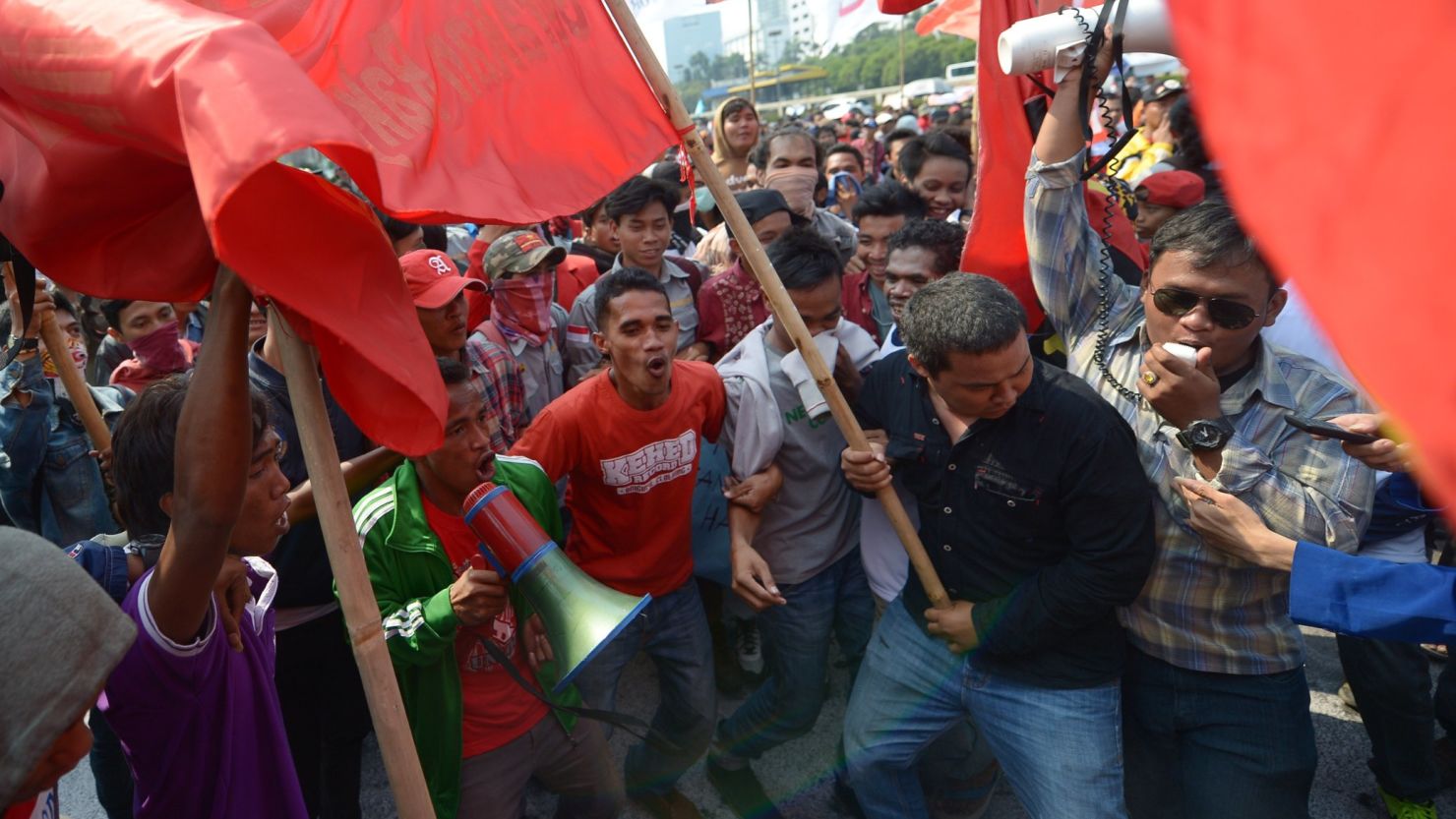 Indonesian students and activists protest against a new bill on local elections in Jakarta.