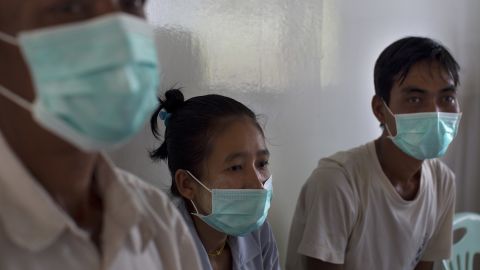 Patients infected with multidrug-resistant tuberculosis wait to be seen by medical staff in Yangon, Myanmar. 