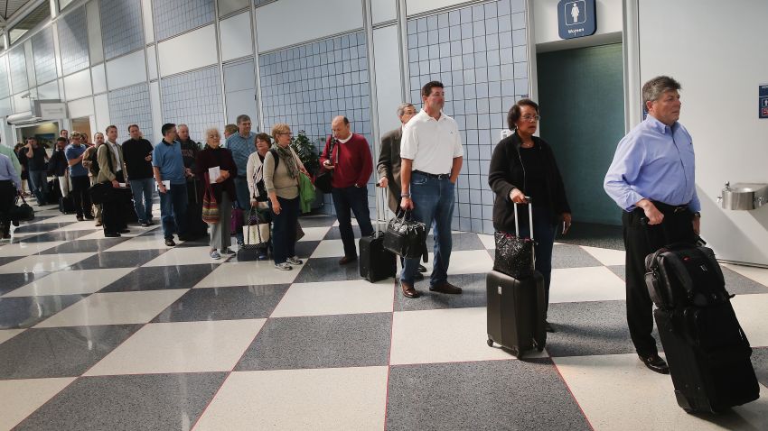 SEPTEMBER 24: Passengers wait in line to go through security screening at O'Hare International Airport's Terminal 1 shortly after the terminal was reopened on September 24, 2014 in Chicago, Illinois. The ticketing and baggage claim areas of the terminal were evacuated for nearly two hours after a after an unattended bag was discovered around 9:30 this morning. (Photo by Scott Olson/Getty Images)