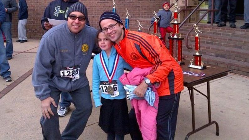Mayor Alex Blanco, Sommer's daughter Maayan and Sommer pose for a photo after a race in Passaic, New Jersey, in October 2013. 