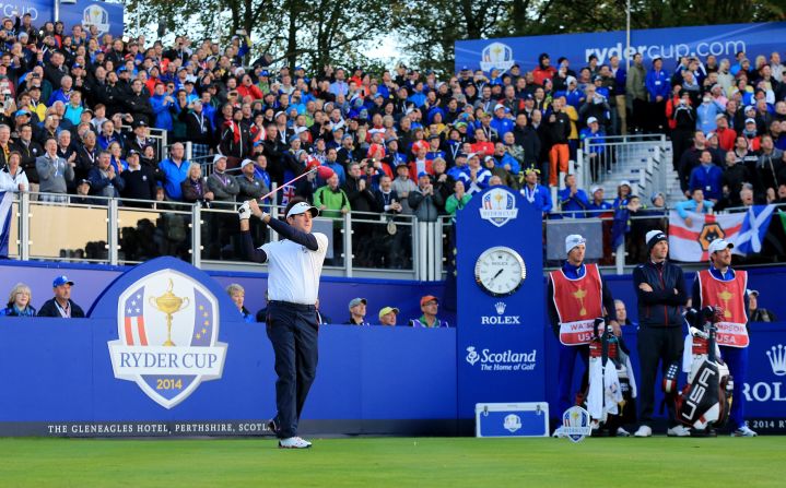 Webb Simpson and Bubba Watson (left) got Team USA's challenge underway on Friday morning in front of crowds massed around the first tee at Gleneagles. 