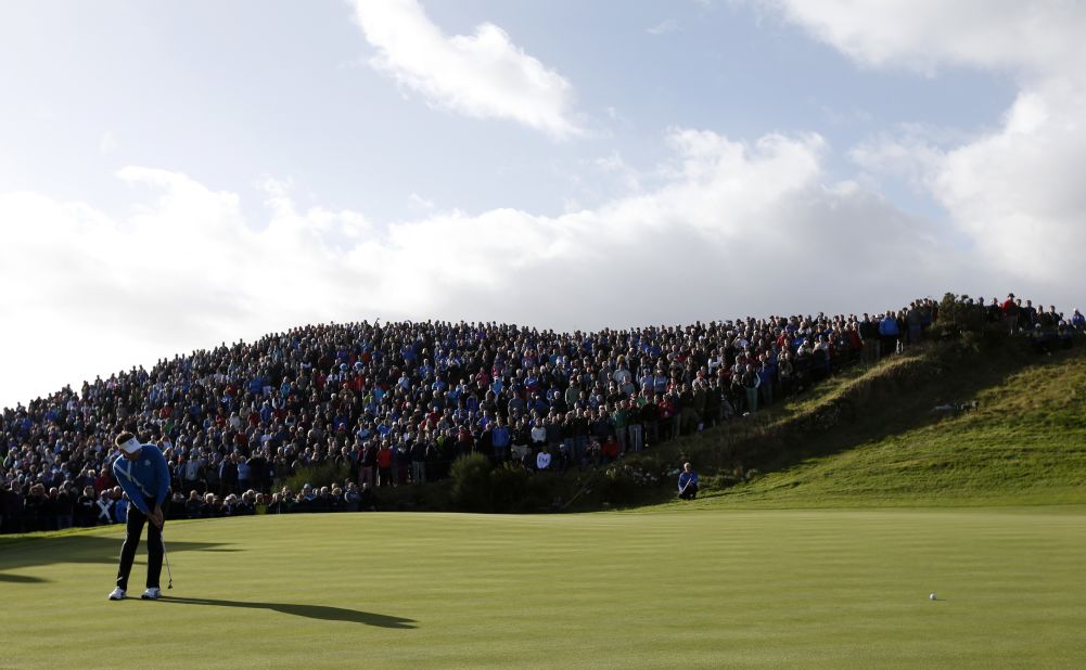 Ian Poulter, one of the stars of Europe's miracle win at Medinah two years ago, putts on the seventh green on Friday morning. Tens of thousands of spectators are attending the three-day event in Perthshire, Scotland. 