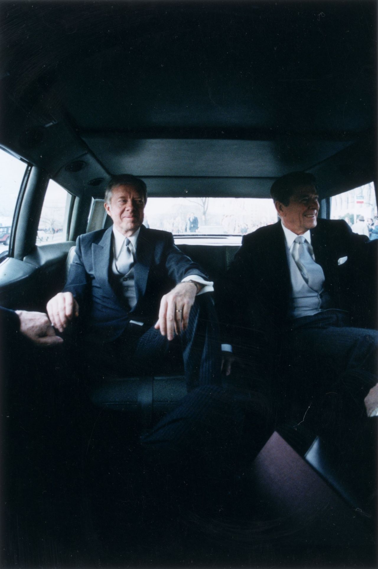 Outgoing President Jimmy Carter, left, sits with president-elect Reagan in the back of a limousine en route to Reagan's inauguration on January 20, 1981.