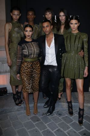 Balmain creative director Olivier Rousteing has been credited with infusing the venerable Paris house with a fresh, pop culture aesthetic, while staying true to the brand's spirit and tradition of craftsmanship. One of his most loyal supporters is U.S. TV personality Kim Kardashian, pictured here with Rousteing and her sister, model Kendall at this year's Vogue Paris Foundation party.