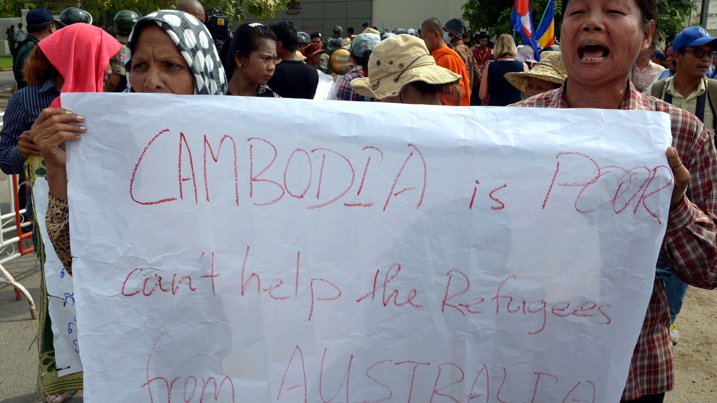 Cambodians protest a deal to take refugees in front of the Australian embassy in Phnom Penh.