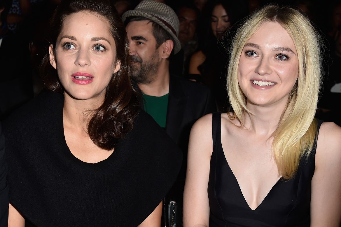 Actresses Dakota Fanning and Marion Cotillard looked stunned by the Dior collection.