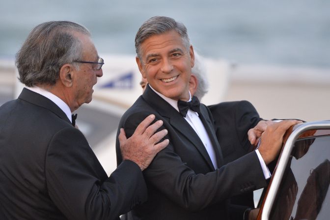 Clooney climbs aboard a taxi boat as he leaves the Hotel Cipriani in Venice on the day of his wedding, Saturday, September 27.