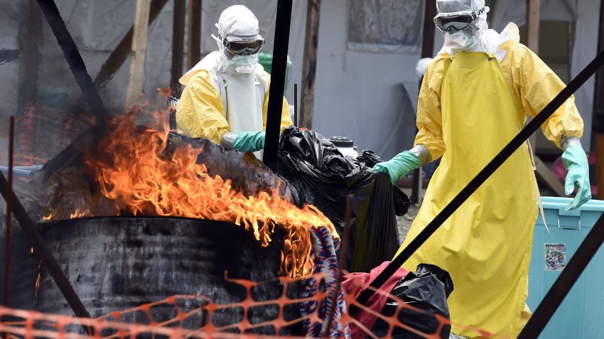 Medical staff members burn clothes belonging to patients suffering from Ebola, at the French medical NGO Medecins Sans Frontieres in Monrovia, Libera on September 27.