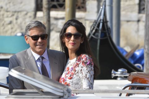 Actor George Clooney and his wife, attorney Amal Alamuddin, stand on a taxi boat on the Grand Canal in Venice, Italy, on Sunday, September 28. Clooney and Alamuddin <a href="http://www.cnn.com/2014/09/29/showbiz/italy-george-clooney-wedding/index.html">married in Venice</a> the previous day at a private ceremony attended by celebrities. 