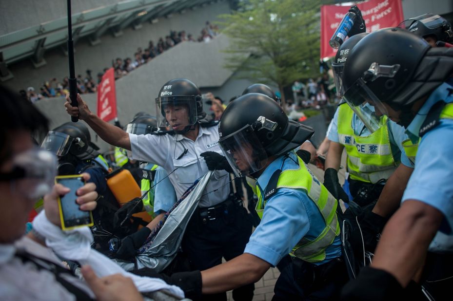 Riot police clash with protesters on September 28. 