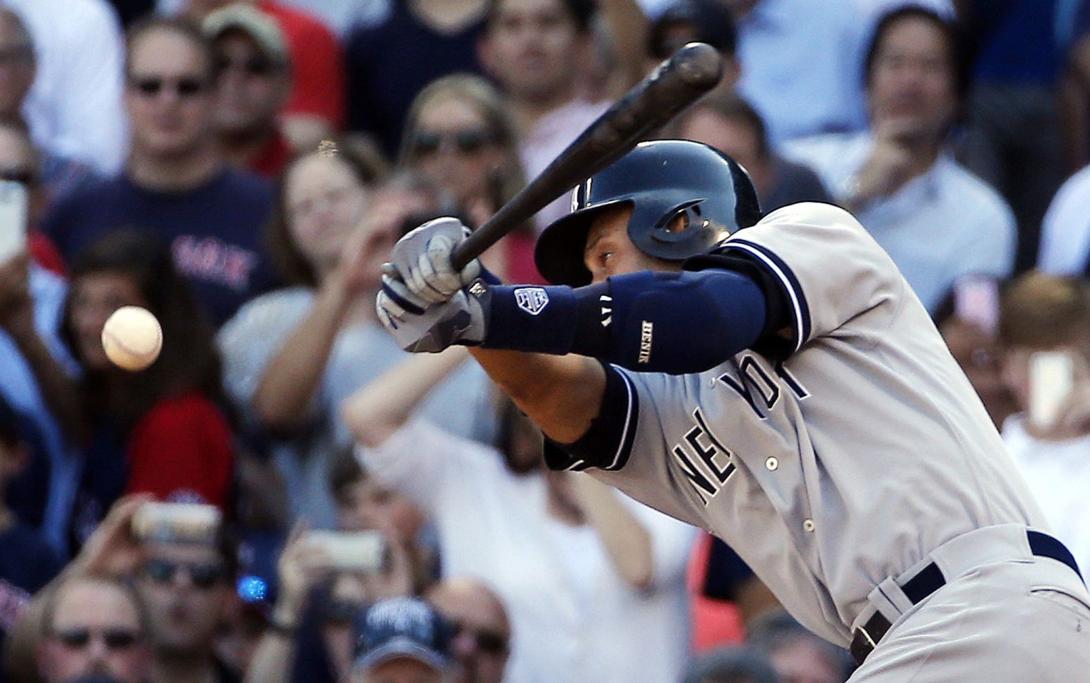 Jeter hits a single against Boston in the final game of his career.