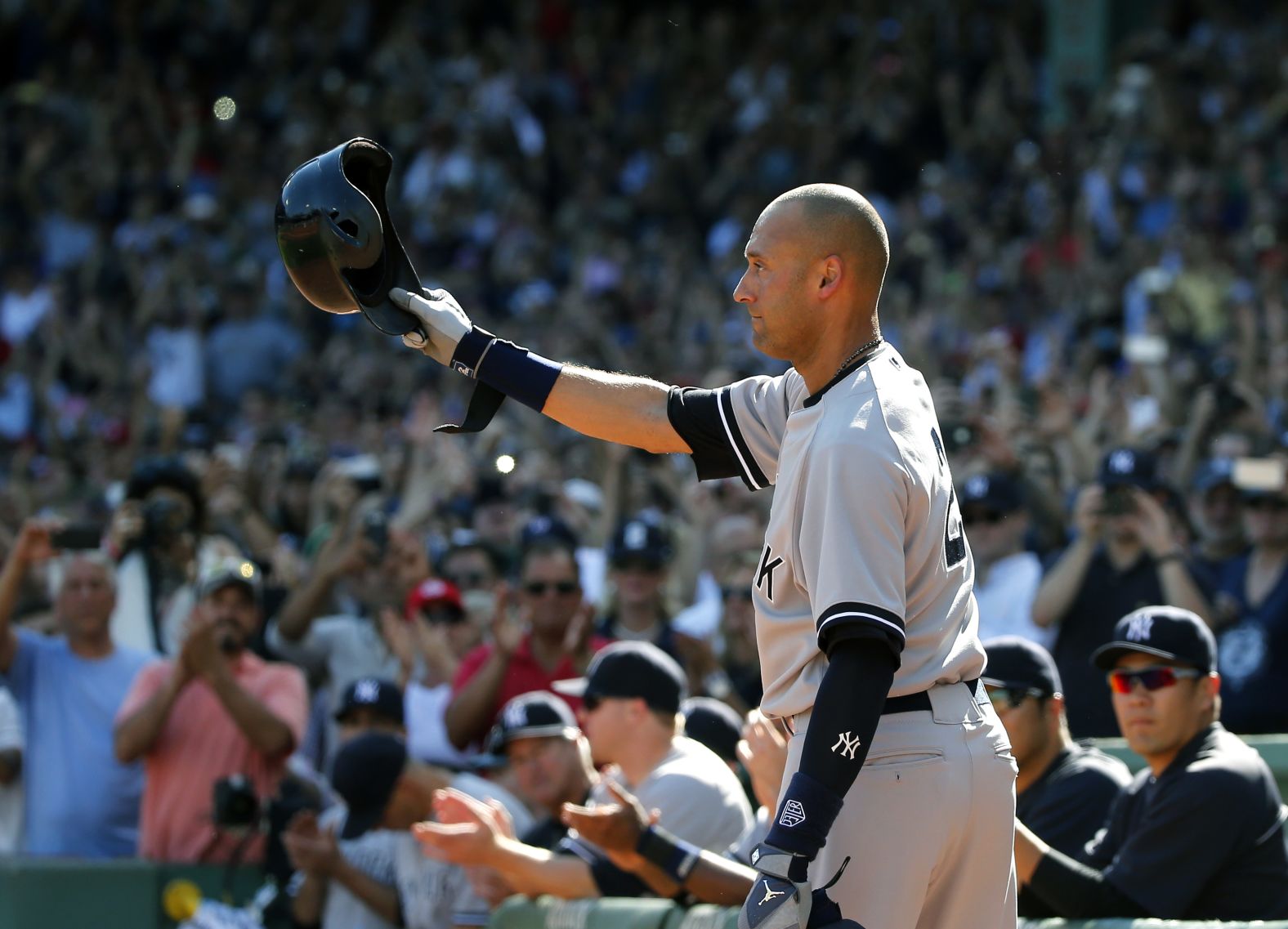 Jeter tips his cap to the crowd at Fenway Park after coming out of his last game in September 2014.