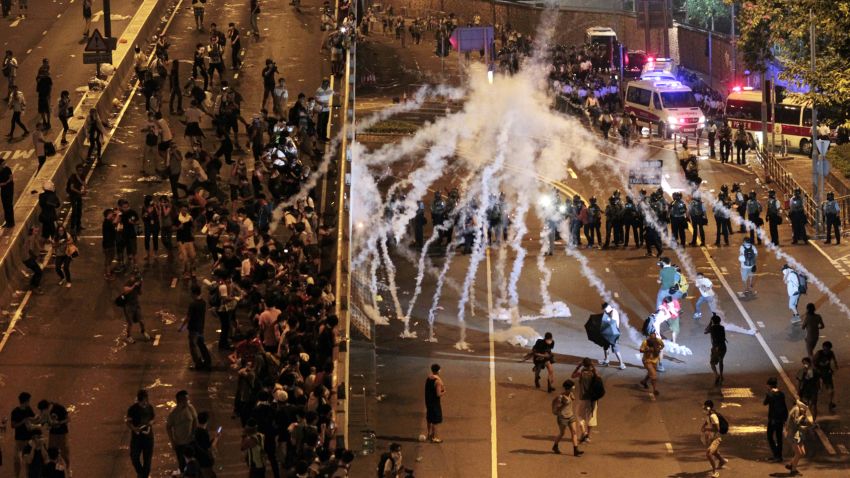 Riot police fire tear gas on student protesters occupying streets around government headquarters buildings in Hong Kong on Monday, September 29.
